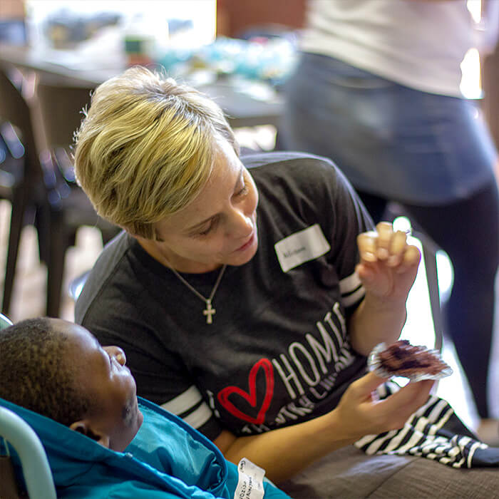 child with disability plays at guguletfu eswatini africa