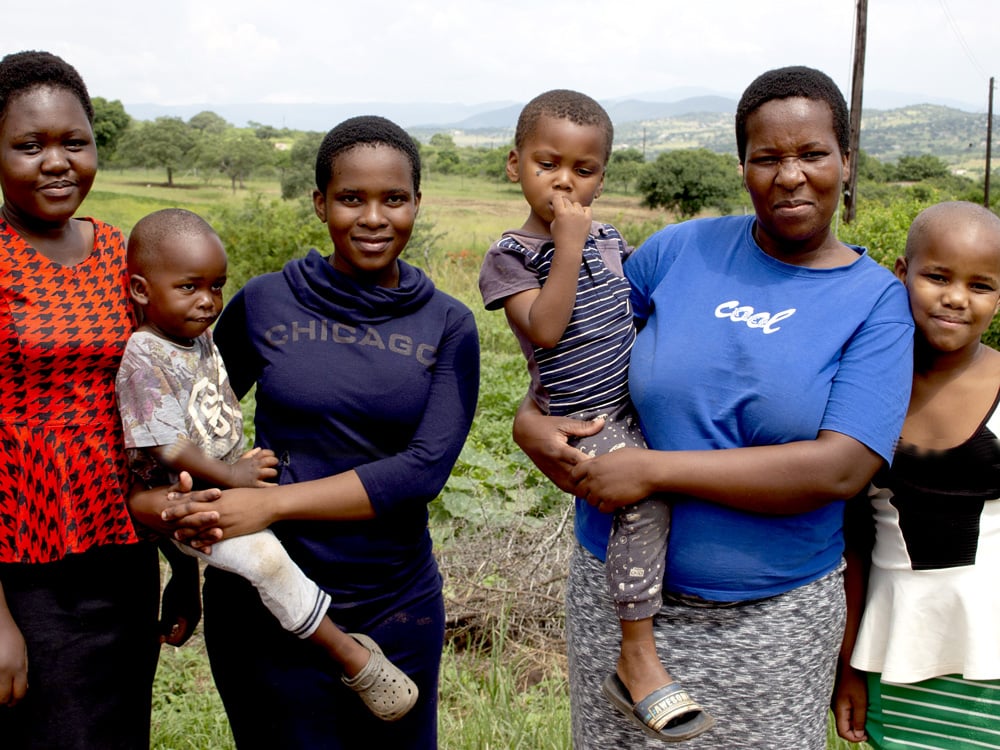 family in eswatini with child receiving school fees